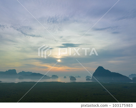 aerial view Amazing light of nature cloudscape sky above Samed Nang Chee Phang Nga archipelago. .Imagine a fantasy bright red sky at sunrise from a bird's eye view..tropical landscape background. 103175983