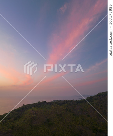 aerial view the sun going down in colorful sky impact on ocean surface The beauty of the cliff fits perfectly with the charming nature in beautiful sunset. cloud scape background aerial view the sun going down in colorful sky impact on ocean surface The beauty of the cliff fits perfectly with the charming nature in beautiful sunset. cloud scape background 103175989
