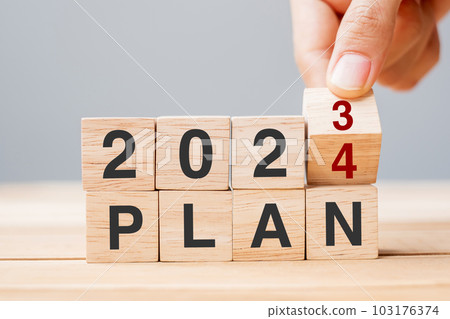 hand flipping block 2023 to 2024 PLAN text on table. Resolution, strategy, goal, motivation, reboot, business and New Year holiday concepts hand flipping block 2023 to 2024 PLAN text on table. Resolution, strategy, goal, motivation, reboot, business and New Year holiday concepts 103176374