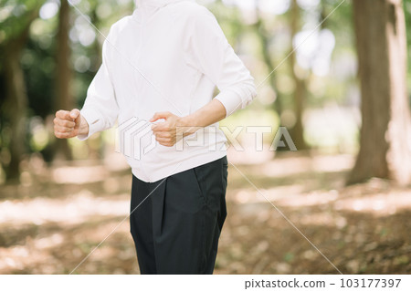 Senior women walking and jogging Senior women walking and jogging 103177397
