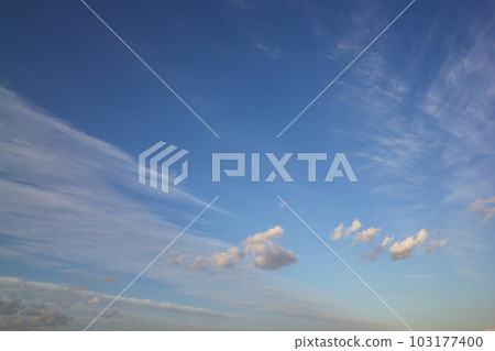 On a sunny afternoon, the white clouds floating in the blue sky are dyed in the colors of the setting sun. Taken in May 2023 On a sunny afternoon, the white clouds floating in the blue sky are dyed in the colors of the setting sun. Taken in May 2023 103177400