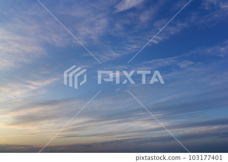 On a sunny afternoon, the white clouds floating in the blue sky are dyed in the colors of the setting sun. Taken in May 2023 On a sunny afternoon, the white clouds floating in the blue sky are dyed in the colors of the setting sun. Taken in May 2023 103177401