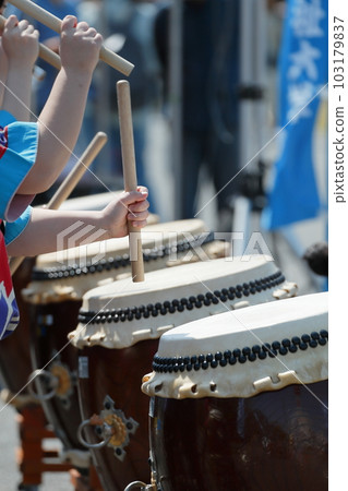 Women playing big drums at a festival Women playing big drums at a festival 103179837