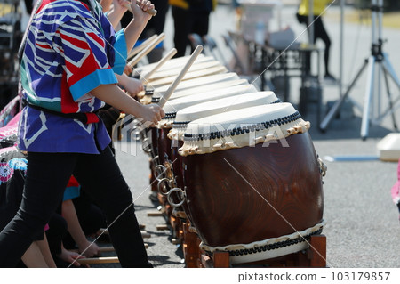 Women playing big drums at a festival Women playing big drums at a festival 103179857