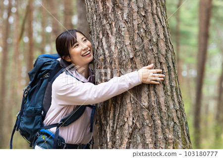 Woman enjoying nature on a hike 103180777