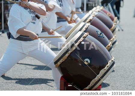 People playing big drums at a festival People playing big drums at a festival 103181084