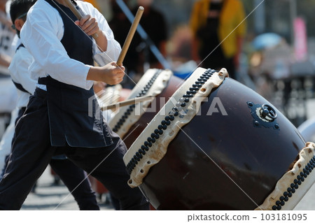 People playing big drums at a festival People playing big drums at a festival 103181095