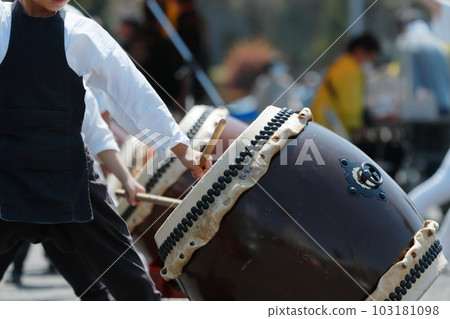People playing big drums at a festival People playing big drums at a festival 103181098