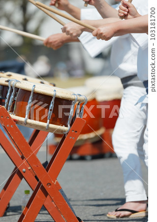 People playing small drums at a festival People playing small drums at a festival 103181700