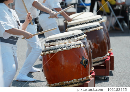People playing big drums at a festival People playing big drums at a festival 103182355