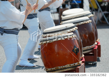 People playing big drums at a festival 103182362