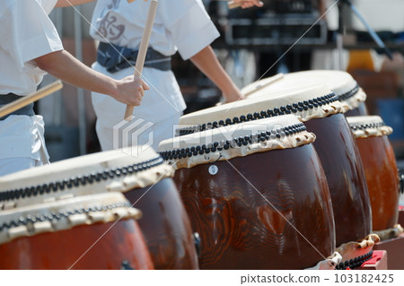 People playing big drums at a festival People playing big drums at a festival 103182425