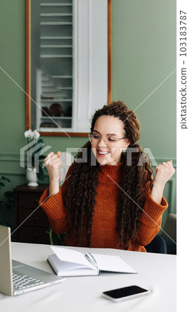Happy Woman Winning Online: Receiving Good News via Email on Laptop. Excited Student Celebrating 103183787