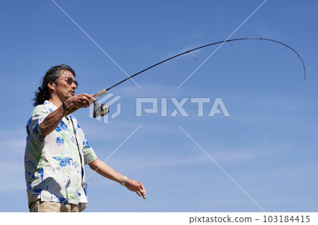 Middle senior men fishing under the blue sky 103184415