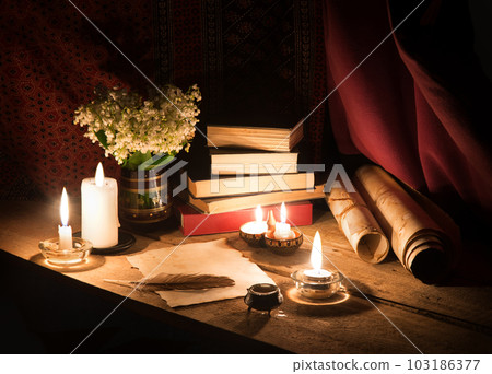 Still life from ancient book and lush boquet 103186377