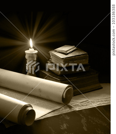 Still life from ancient books with candles 103186388