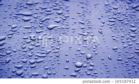 Raindrops on the hood of a car Raindrops on the hood of a car 103187412
