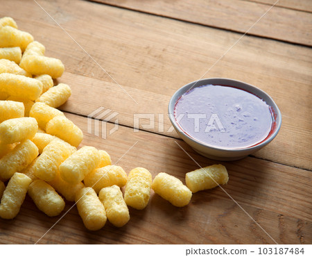 Corn sticks on wooden background Corn sticks on wooden background 103187484