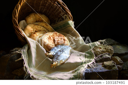 Five loaves and two fish in a basket Five loaves and two fish in a basket 103187491