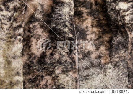 Fur texture close up. Fur on winter women's clothing. Fur texture close up. Fur on winter women's clothing. 103188242