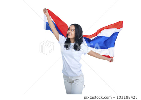 Asian women celebrate Thailand's independence day on 05 December by holding the Thailand flag 103188423