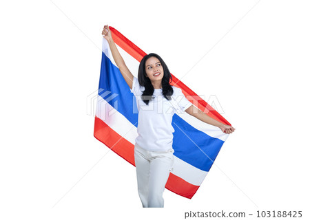 Asian women celebrate Thailand's independence day on 05 December by holding the Thailand flag Asian women celebrate Thailand's independence day on 05 December by holding the Thailand flag 103188425