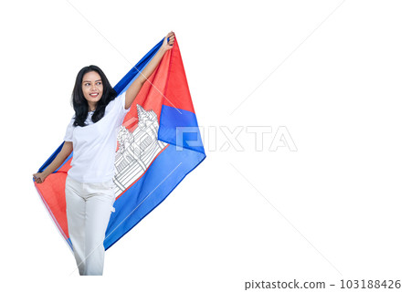 Asian women celebrate Cambodia independence day on 09 November by holding the Cambodia flag 103188426