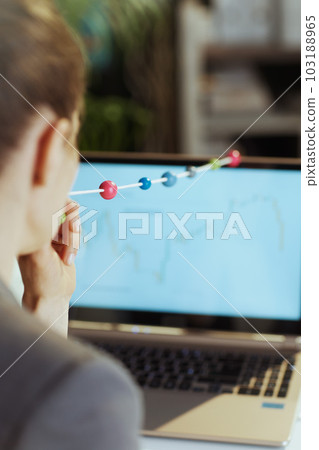 business woman in grey business suit at work doing eye exercise business woman in grey business suit at work doing eye exercise 103188965