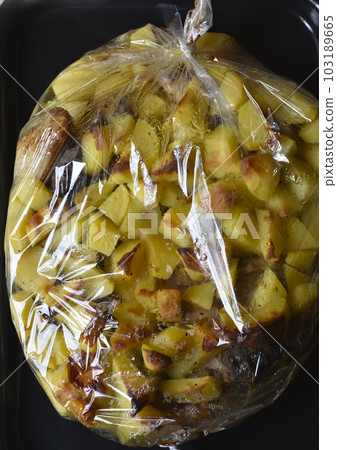 Chicken potatoes baked in a bag. Baked potatoes. Chicken potatoes baked in a bag. Baked potatoes. 103189665