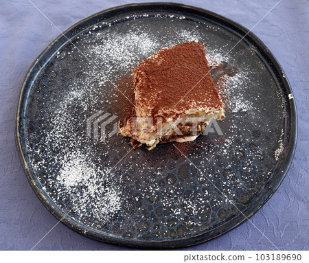 A portion of tiramisu, a traditional Italian dessert. A portion of tiramisu, a traditional Italian dessert. 103189690