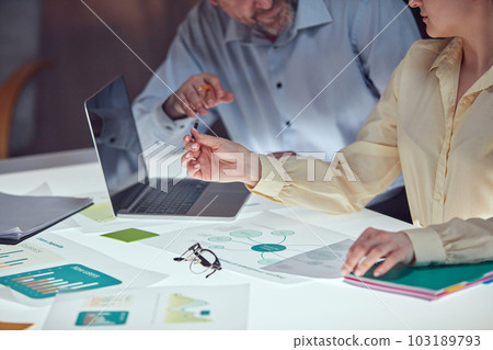 Beautiful business people are using gadgets and laptop, talking during the conference in office over meeting room background 103189793