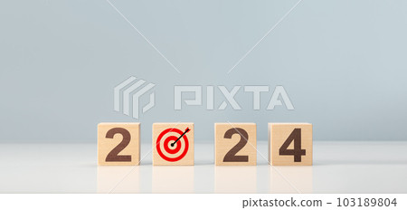 2024 goal, plan, action. 2024 happy new year concept, wooden cube block with target goal and 2024. Business management, Inspiration to success ideas and goals. 103189804
