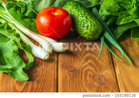 Set of vegetables for a salad diet on a vintage table. Cooking salad in the restaurant kitchen. Free ad space 103190116