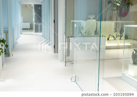 Well-lit empty corridor in contemporary business center 103193094