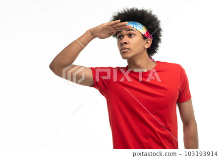 Young guy in red tshirt looking anticiapted Young guy in red tshirt looking anticiapted 103193914