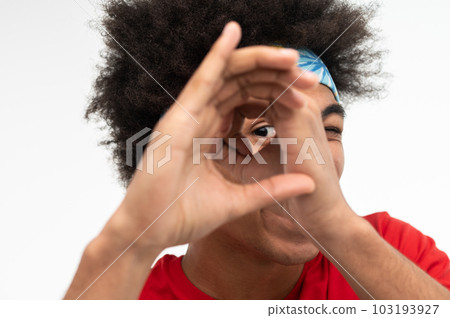 Young guy in red tshirt looking anticiapted 103193927