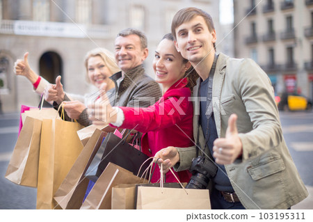 parents with older children rejoice with many shopping packages after successful shopping parents with older children rejoice with many shopping packages after successful shopping 103195311