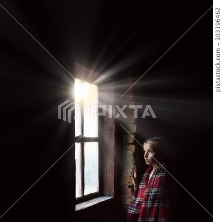 Girl at the window on a black background Girl at the window on a black background 103196462