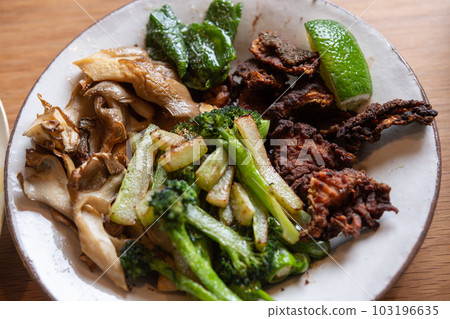 Crispy grilled flounder skin and grilled vegetables 103196635