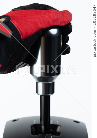 Hand in red gloves change gear 103198647