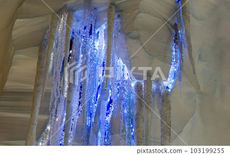 Artificial blue icicles indoors. christmas decorations on the ceiling 103199255