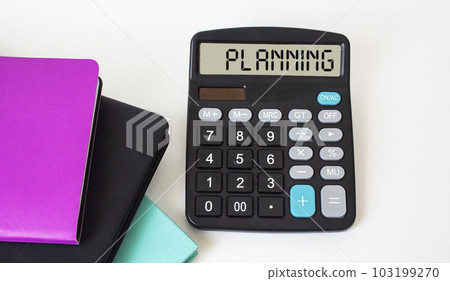 The calculator displays the text Planning, next to colored notebooks and on a white background. 103199270