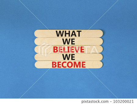 We become or believe symbol. Concept word What we believe We become on wooden stick. Beautiful blue table blue background. Business we become or believe concept. Copy space. 103200021
