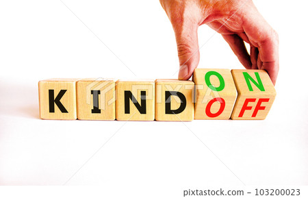 Kind on or off symbol. Businessman turns wooden cubes and changes word Kind off to Kind on. Beautiful white table white background. Business and kind on or off concept. Copy space. Kind on or off symbol. Businessman turns wooden cubes and changes word Kind off to Kind on. Beautiful white table white background. Business and kind on or off concept. Copy space. 103200023