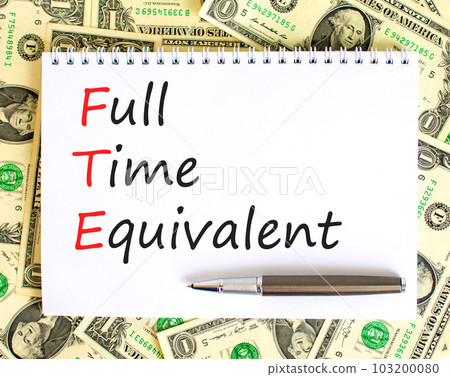 FTE Full time equivalent symbol. Concept words FTE Full time equivalent on white note. Dollar bills. Beautiful background from dollar bills. Business and FTE Full time equivalent concept. Copy space. FTE Full time equivalent symbol. Concept words FTE Full time equivalent on white note. Dollar bills. Beautiful background from dollar bills. Business and FTE Full time equivalent concept. Copy space. 103200080