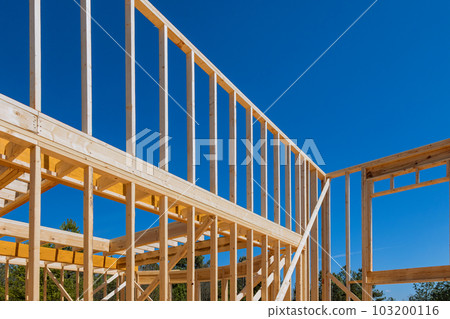 During construction, wooden framework was carried for beam stick home of layout joists trusses During construction, wooden framework was carried for beam stick home of layout joists trusses 103200116