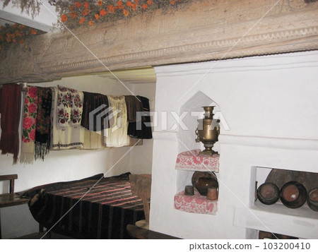 Step into a historic Ukrainian dwelling and be captivated by the array of antique household utensils that offer a glimpse into the bygone era. Step into a historic Ukrainian dwelling and be captivated by the array of antique household utensils that offer a glimpse into the bygone era. 103200410