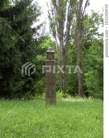 An ancient pagan Slavic idol in a clearing in the forest. An ancient pagan Slavic idol in a clearing in the forest. 103200419
