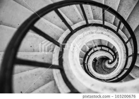 Old vintage spiral staircase. Black and white photography. 103200676