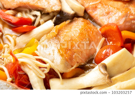 Stir-fried salmon and mushrooms with butter ponzu sauce. 103203257